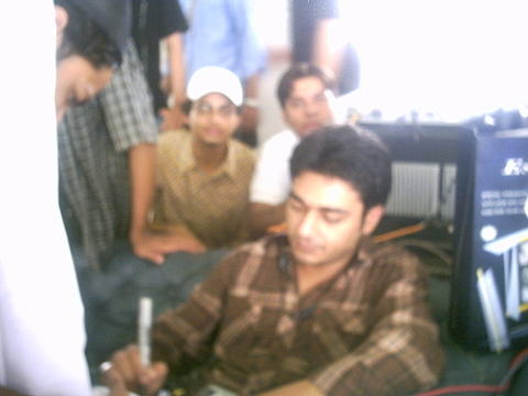 AZFAR THE FOUNDERS OF THIS CAMPAIGN AT UBL GIVING AN AUTOGRAPH