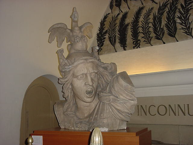 This is a head that was once on the top of the Arc de Triumph. After renovating it now sits inside on the top level of the Arc on display.
