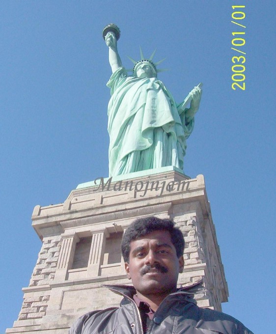  At the foot of The statue of Liberty.