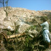 Aziz inspecting the damage