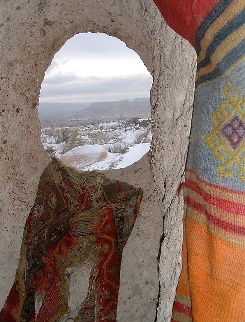  Snowy view through an ancient window, Uchisar 