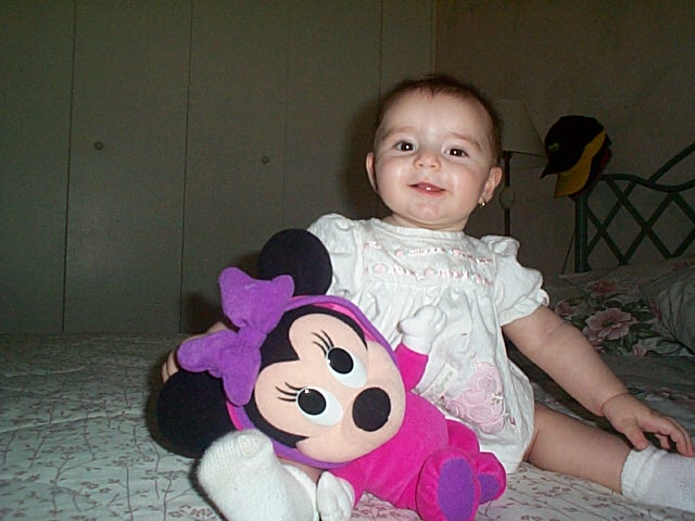 This is our little angel Victoria Solenne.&nbsp; This is the day she turned six months old and when she learned how to sit down on her own.&nbsp; Our baby's favorite doll (Mini) is also "part of the family".