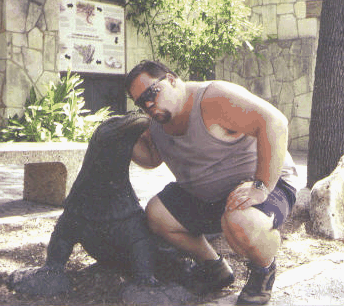 Mark kisses a komodo dragon