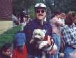 Kelsey in Mark's arms at the Westie Walk in Wayzata, Minnesota.  She has a lumberjack outfit on for the parade.