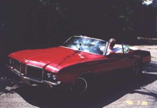 Tom in the Olds shortly after he purchased it in 2000.