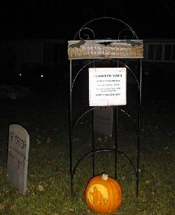 The sign basically says that it's a haunted yard and it may not be suitable for little kids