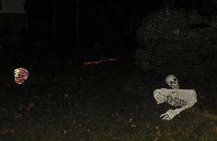You can't see them, but rope lights lead you through a graveyard to the entrance.