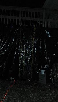 The entrance is through the slits in the black plastic