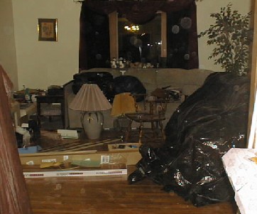 Living Room - Floor is in, but needs trim and had to move everything in there to do dining room.