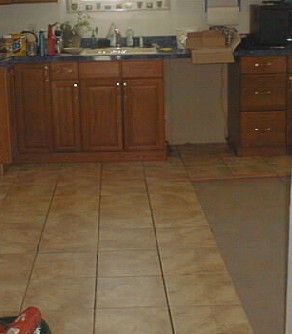 Kitchen - Laying the tile.