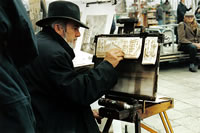 An artist drawing a picture in Venice, Italy
