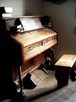 Old piano at the Crooked Church in Llanthony, Wales