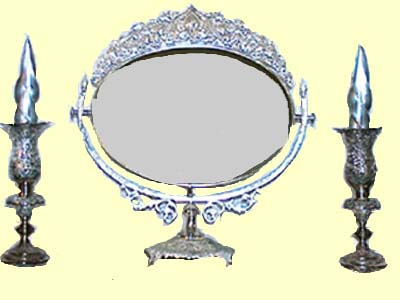 engraved silver mirror and candle holders