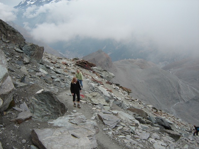 Click to enlarge: The final ascent to the Berghaus Matterhorn.  The buildings or Schwarzsee can be seen in the distance to the right of the women.