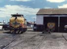 Locomotora Alsthom 8006 detenida a ordenes en Deposito Base Tandil junto a otra. Circa 1975. Miguel Angel Pignataro