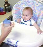 20050103_06a-DaddyMatt_offeringEm_sippycup.jpg
