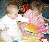 20050206_26a-EmilyHiggins-almost7mo_sharingbook_EmmaleighReynolds-9mo-HigginsMilwaukee.jpg