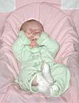 20050311_02w-EmilyGraceHiggins-8mo_greenvelvetoutfit_fromGrandmaBrendaHaroldsen-rubbinghereyes.jpg