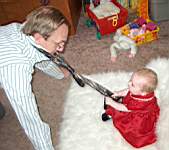 20050313_06a-EmilyGraceHiggins-8mo_haulingonDaddyMattsTie.jpg
