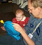 20050321_01b-EmilyGrace-8mo_puzzledbyDaddyMatttoy_animalnoisesSee-N-Say.jpg