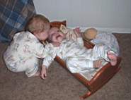 100_0558wl_Em_MikeInDollCradle.jpg
