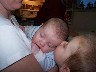 William, ever loving, giving Matthew a kiss in Moms arms 