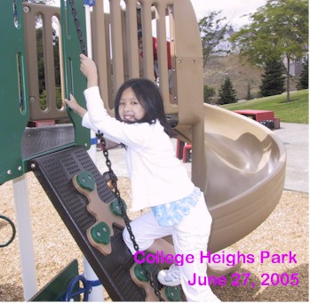Emily climbing up the slide