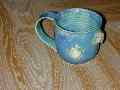 coffee cup with seashells