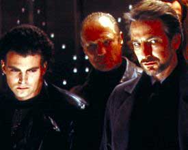 Hans Gruber (Alan Rickmen) (right) with a batch of his cohorts as they siege Nakatomi Plaza