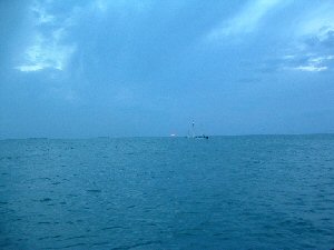 original picture of yacht sailing at sunset