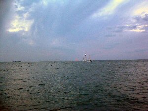 color corrected picture of yacht sailing at sunset