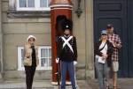 Crew stands with guard