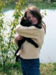 Eriel holds the cat at the stables