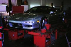 NSX F16 on alignment rack. Check out the 97 OEM front chin spoiler (now removed)