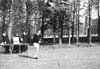 Billy McCarthy lifting sports trophy, 1960 (Album 4)