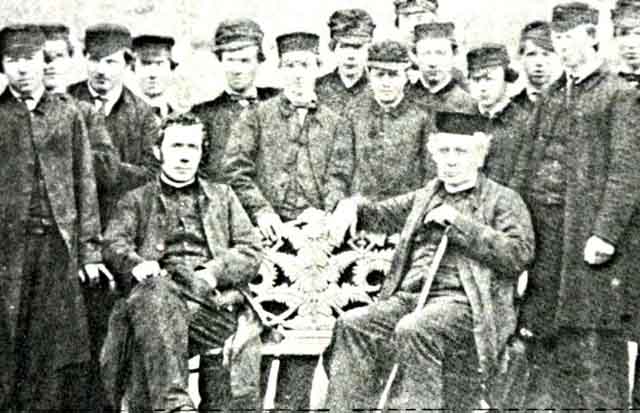 Students from long ago - note the bench (and the hats!) and look at the more modern picture below