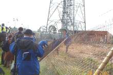 police crossing fence
