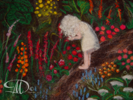 Girl looking at flowers in a flower garden