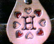 H with mini hearts on natural