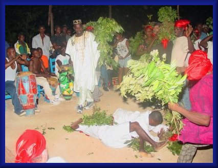 Loulou Prince brings leaves into a Petro ceremony