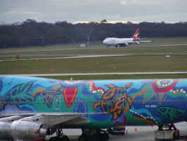 Click to enlarge: Elke and Elina's plane leaving Melbourne... it's the white one in the background