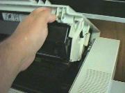 Fully
        open the printer by raising the top half