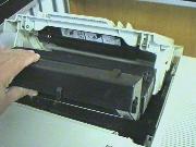 Insert
        the new toner cartridge