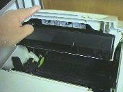 Close
        the printer by lowering the lid