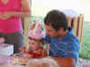 firstbiteoffirstbdaycake.jpg (40431 bytes)