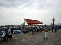 Gondoleri plying for trade in Venice