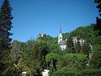Bled Castle with the local Church below as seen from the public park