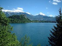 Looking towards Bled Castle from the island with the Karavanke Mountains in the distance