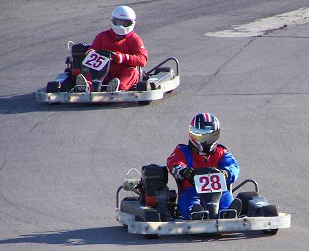 Michael leads kart #25 through turn four