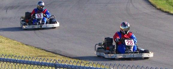 Michael leads kart #13 through turn four